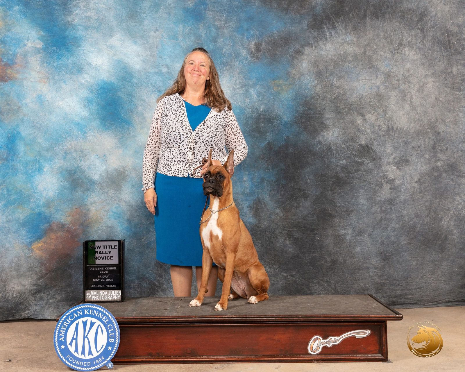 AKC Boxer champion on the winners podium, RAM BOXERS show program